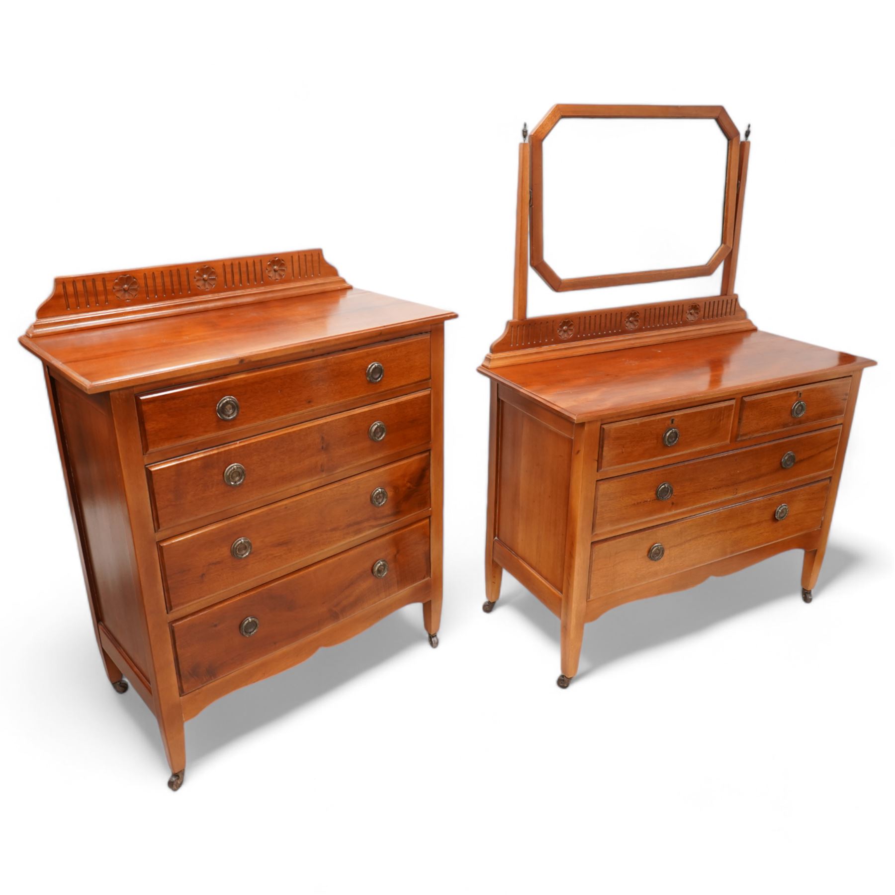 Early 20th century mahogany three piece bedroom suite - comprising a triple wardrobe (W119cm D47cm H194cm); chest with raised back, fitted with four long drawers (W93cm D49cm H115cm); and dressing table with swing mirror back (W108cm D49cm H152cm), each decorated with rosette and fluted designs, on square tapering feet