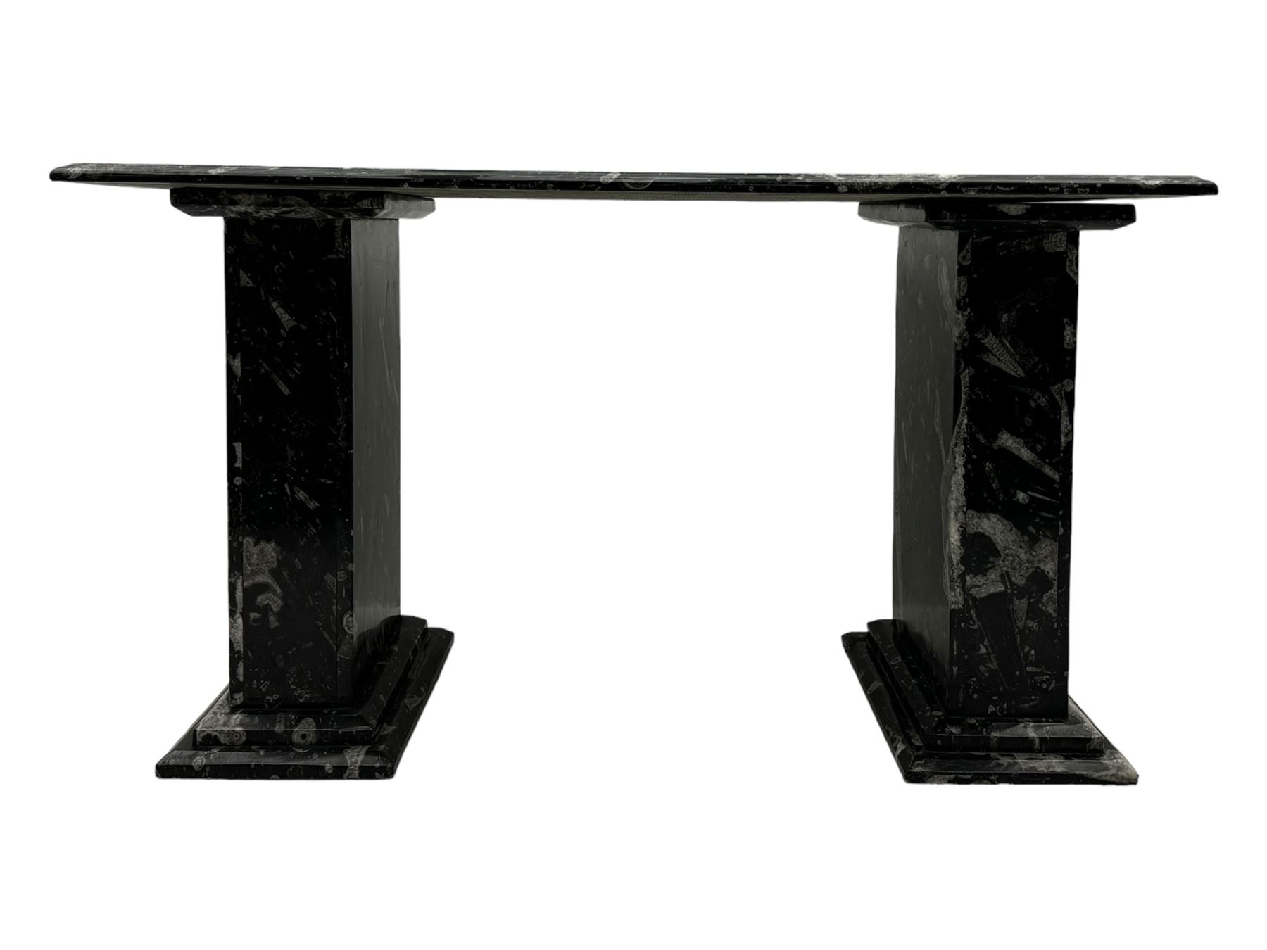 Marble hall table with orthoceras and goniatite inclusions, the rectangular top upon two rectangular stepped plinths, H78cm, L135cm, D77cm