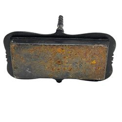 Black painted cast iron boot scraper with handle, decorated with scroll work with shaped tray 