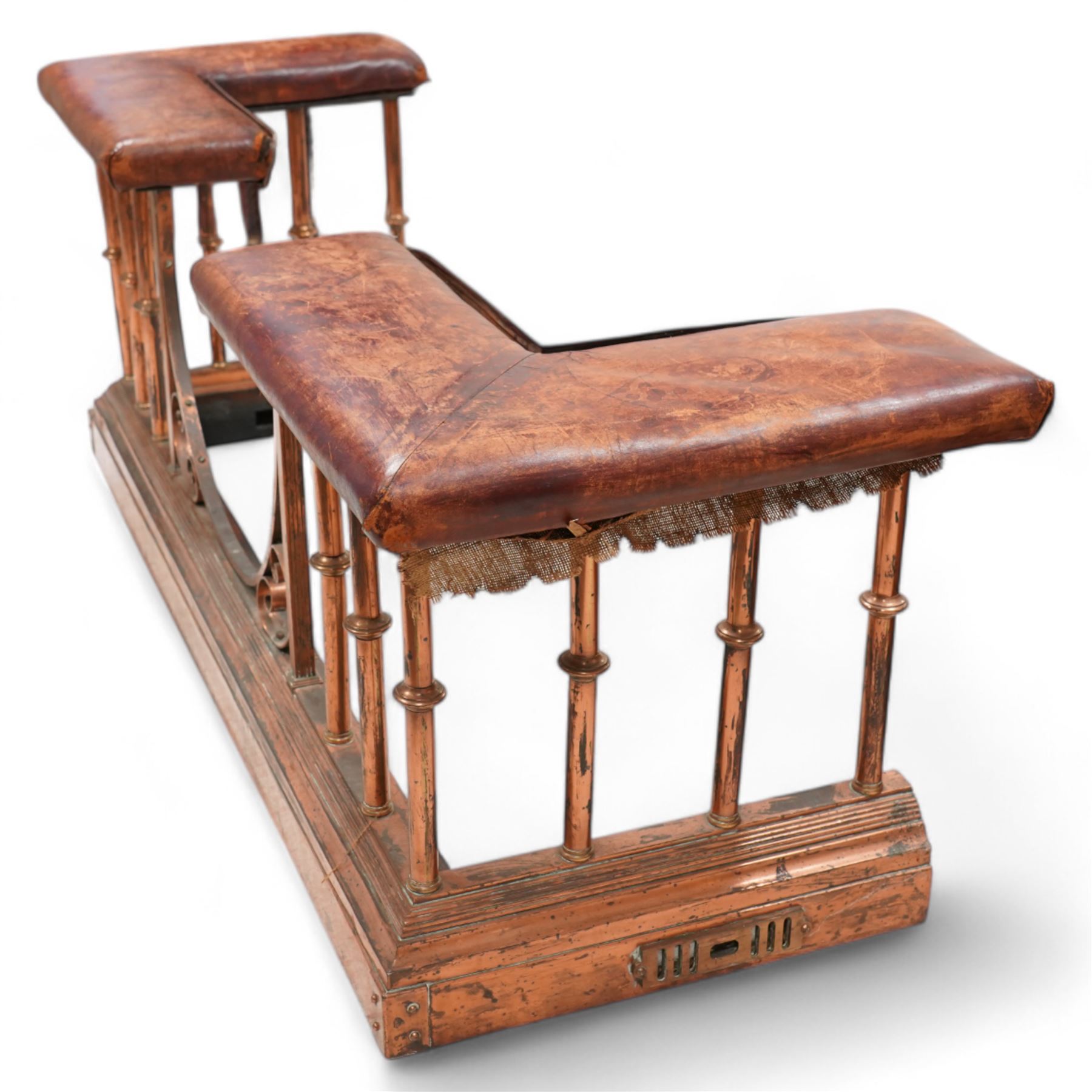 Victorian copper club fender, leather upholstered cushioned seats on turned balustrade supports, drop centre with C-scroll corner brackets, on stepped moulded curb 