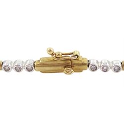 9ct gold round brilliant cut diamond bracelet, ten white gold links, each set with three diamonds, spaced by yellow gold bar links, hallmarked