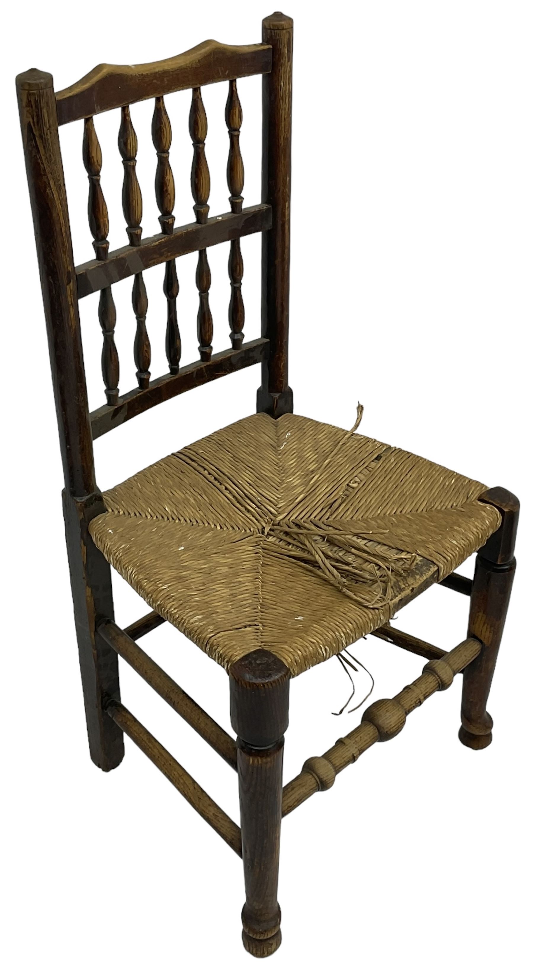 Collection of chairs - five 19th century elm spindle back chairs with rush seats; two chapel chairs (7)