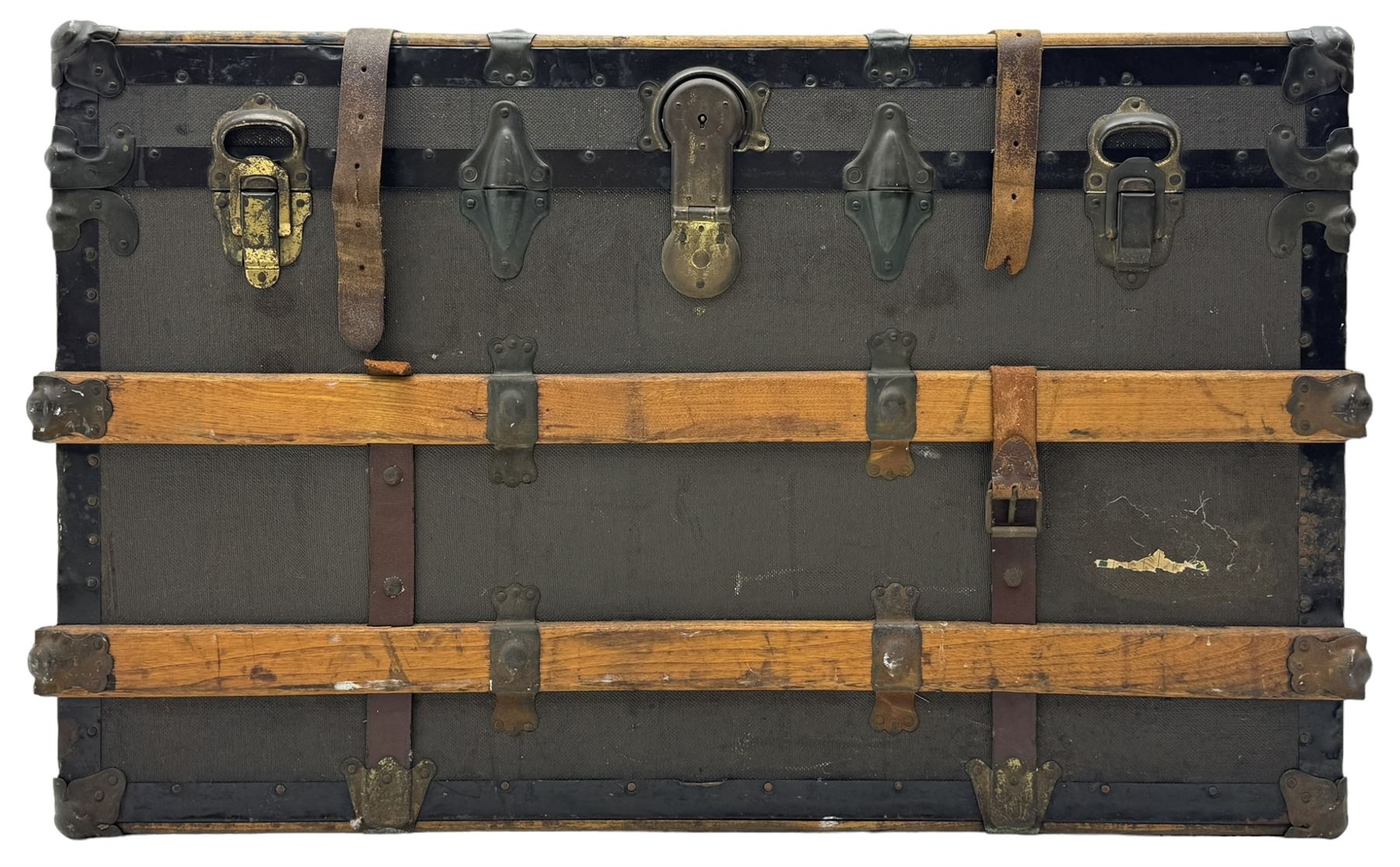 Early 20th century 'McBrine Baggage' steamer trunk, oak frame and black canvas covering, featuring metal hardware and leather straps, fitted with central lock, additional latches, and corner protectors, the interior is lined with floral-patterned paper and includes a removable top tray with makers label 