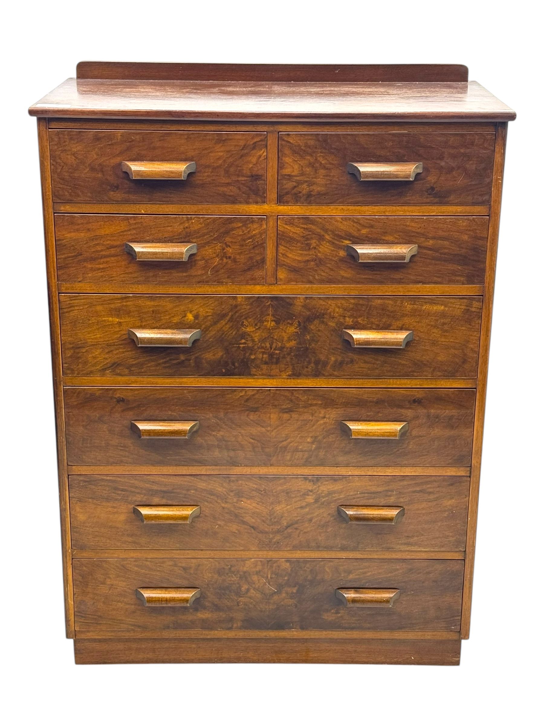 Early 20th century walnut chest, fitted with four short and four long drawers, on recessed plinth base