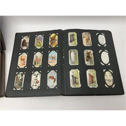 Four albums of cigarette cards, including Will's and Player's examples