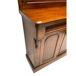 Victorian mahogany chiffonier, raised back with carved C-scroll foliage mounts and shelf, rectangular top with rounded corners over frieze drawer and double panelled cupboard, on skirted base