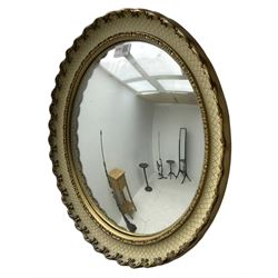 Convex wall mirror in cream and gilt finish frame