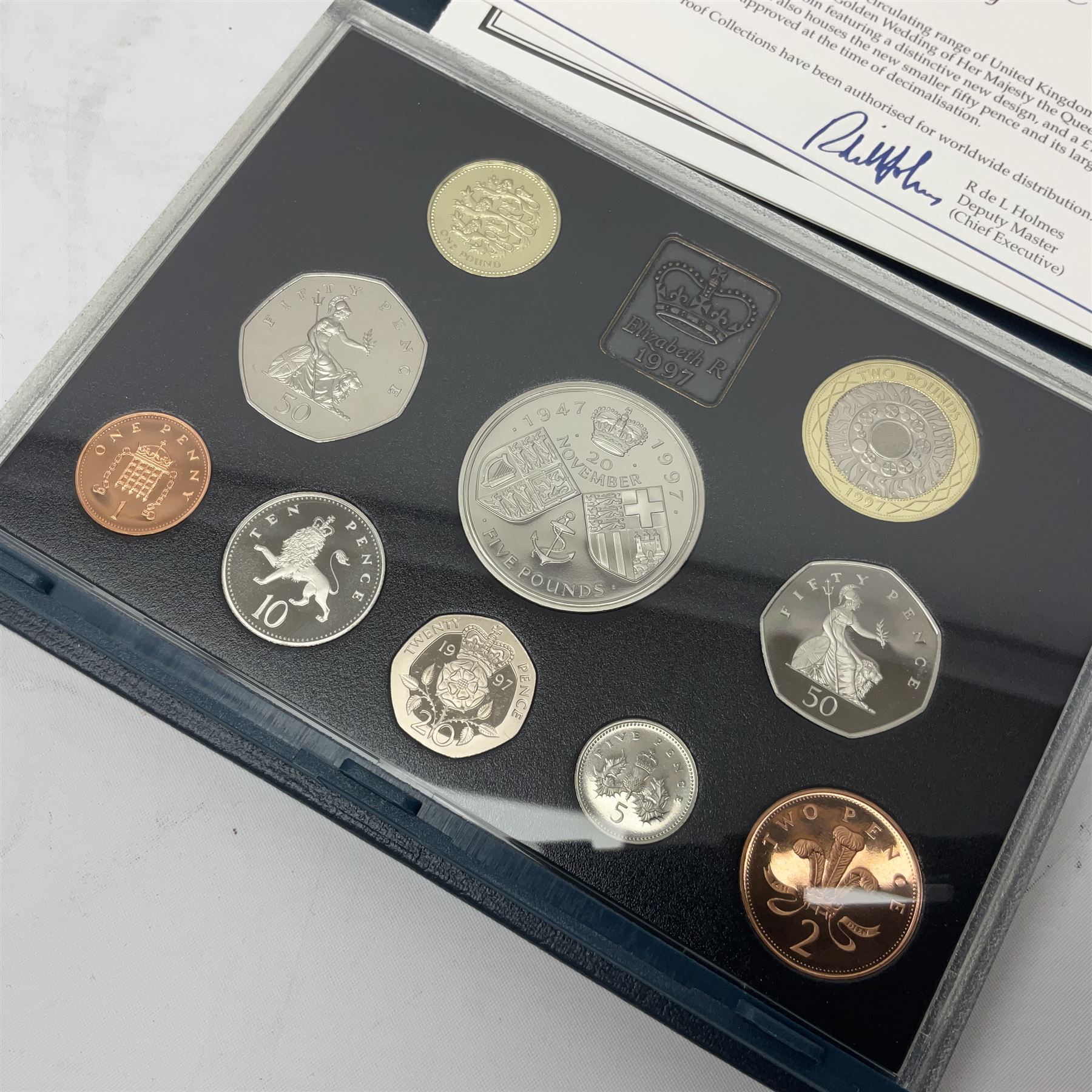 Ten The Royal Mint United Kingdom proof coin collections, dated 1983, 1984, 1985, 1986, 1987, 1992, 1994, two 1997 and 1998 all in blue folders with certificates