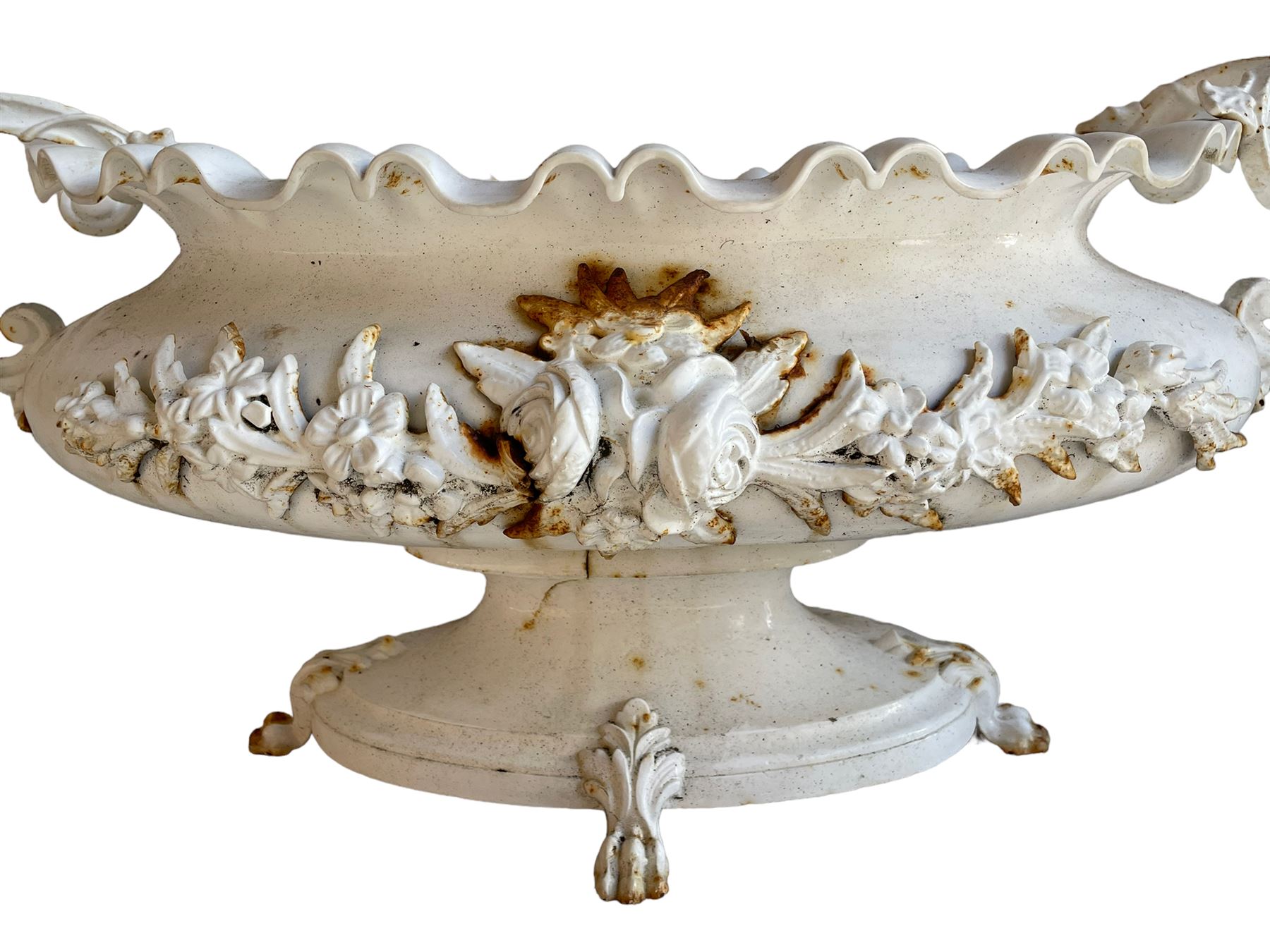 Corneau Alfred á Charleville - mid-19th century French cast iron planter, swollen and waisted oval form with scalloped upper rim, scrolled and ivy leaf cast handles, the front mounted by extending floral casting, on oval footed base with foliage and paw cast feet, the interior with drainage holes, inscribed 'Corneau Alfred á Charleville No 3' 