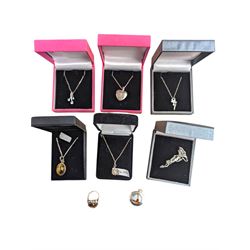 Silver jewellery, including five pendants/locket necklaces, brooch, enamel golf theme locket pendant and a paste ring, six boxed