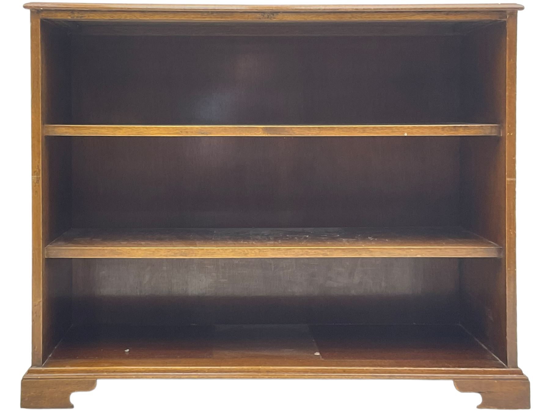 20th century mahogany open bookcase, fitted with two shelves, on bracket feet