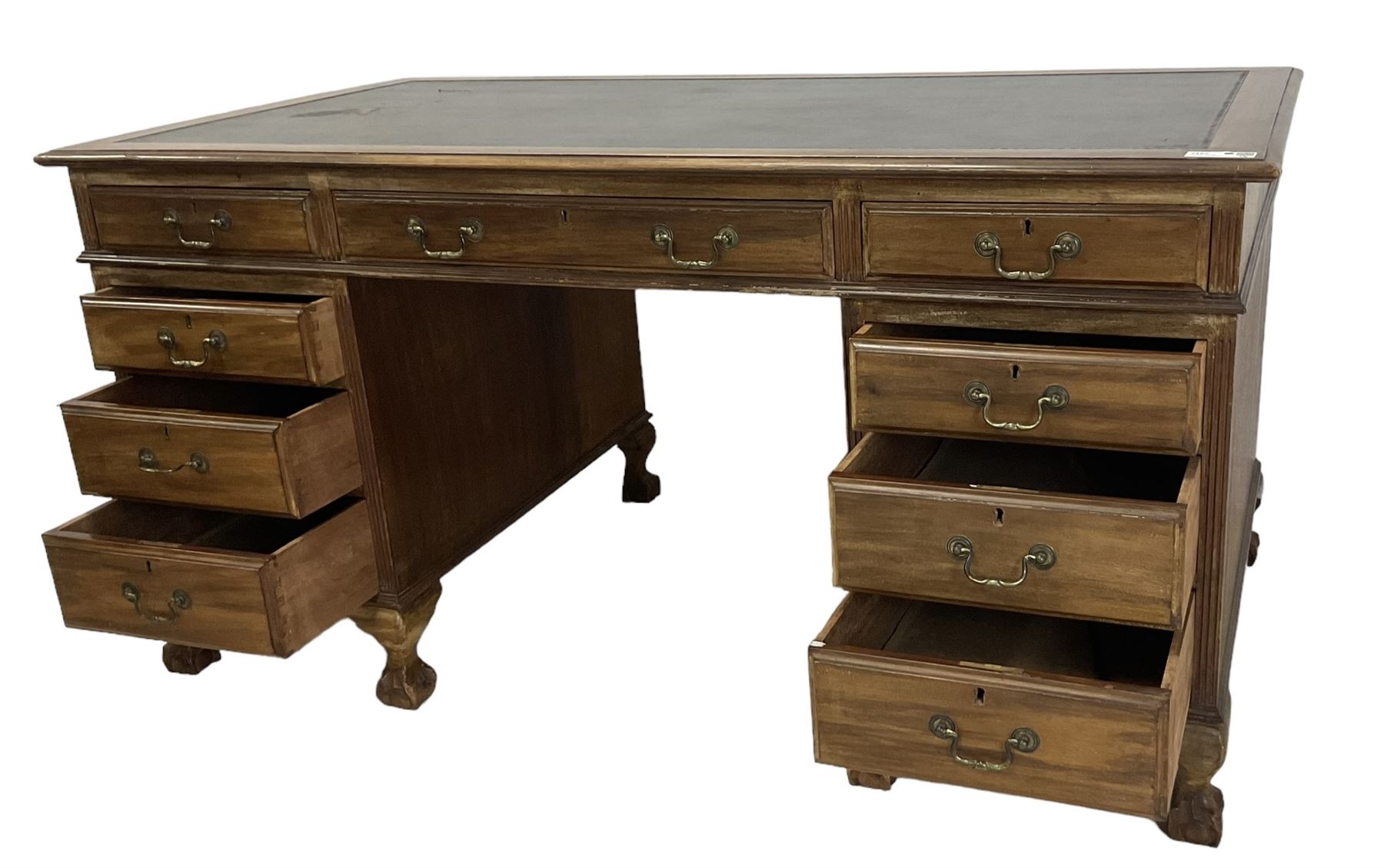 Georgian design twin pedestal desk, rectangular top with green leather inset, fitted with nine drawers, on cabriole supports with ball and claw feet 