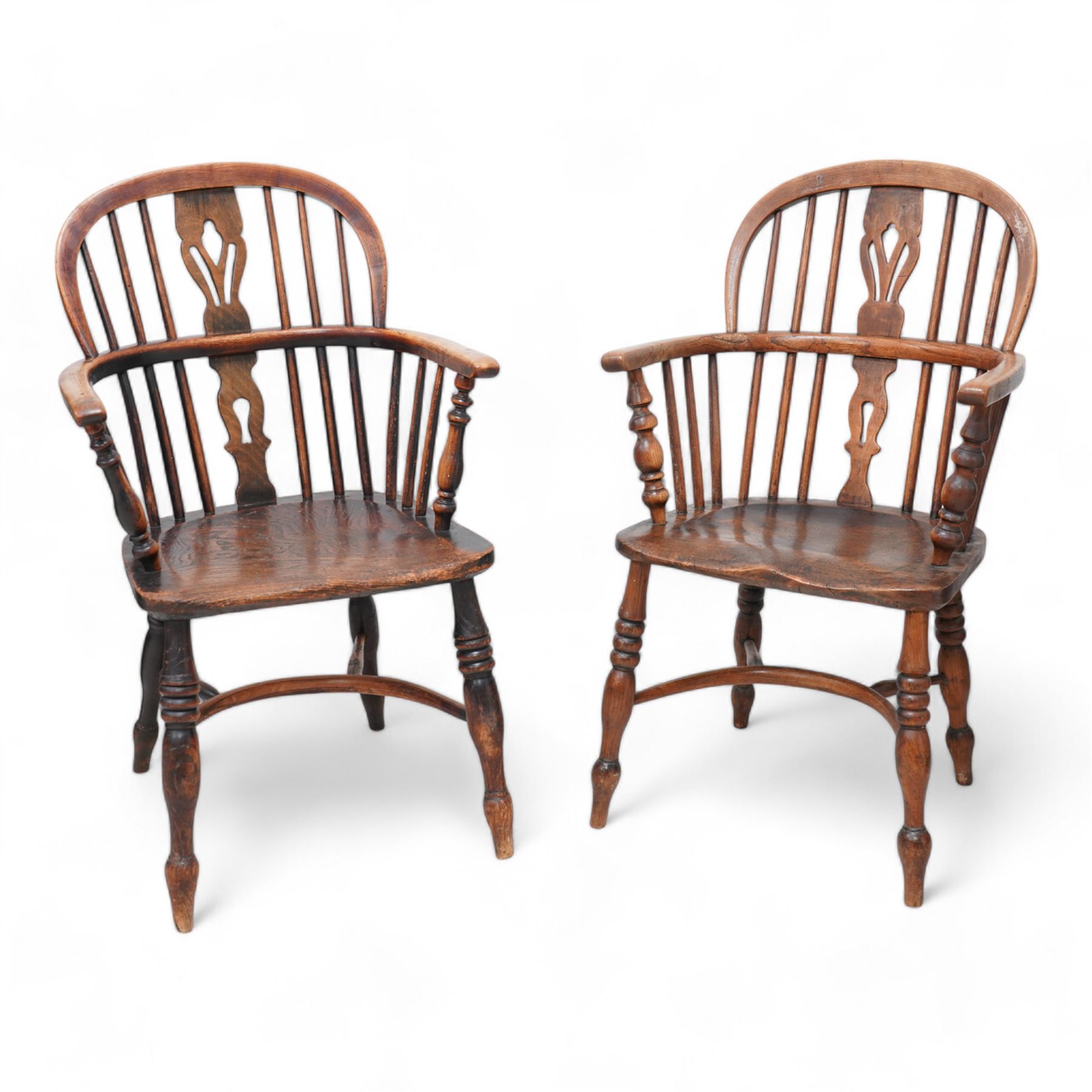 Near pair of 19th century elm and ash Windsor armchairs, each with double hoop and stick back with shaped and pierced splat, dished seat on turned supports united by crinoline stretcher 