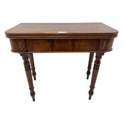 19th century mahogany tea table, fold-over swivel action rectangular top with rounded corners, figured frieze with stepped lozenge mounts, on turned supports