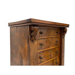 Victorian burr walnut Wellington chest, rectangular top with book-matched veneers, two hinged uprights with scrolled foliage carved brackets enclosing seven graduating drawers, on plinth base 