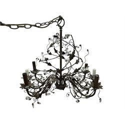 India Jane Interiors - contemporary wrought iron chandelier, adorned with vine and leaf motifs intertwined with faceted glass crystal drops, curved arms supporting six candle-style light fittings, the central stem terminating in a suspension loop