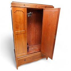 Early 20th century mahogany three piece bedroom suite - comprising a triple wardrobe (W119cm D47cm H194cm); chest with raised back, fitted with four long drawers (W93cm D49cm H115cm); and dressing table with swing mirror back (W108cm D49cm H152cm), each decorated with rosette and fluted designs, on square tapering feet