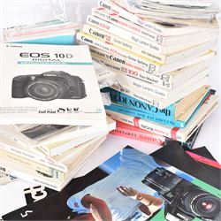 Large collection of Canon camera reference books, brochures, user's guides and instruction manuals, including Canon Compendium by Bob Shell, copies of Lens Wonderland, EOS camera guides, etc 