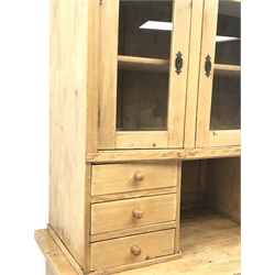Early 20th century pine kitchen cupboard, raised glazed cabinets with drawers, lower section fitted with two drawers and panelled double cupboard, turned feet,  W127cm, H195cm, D62cm