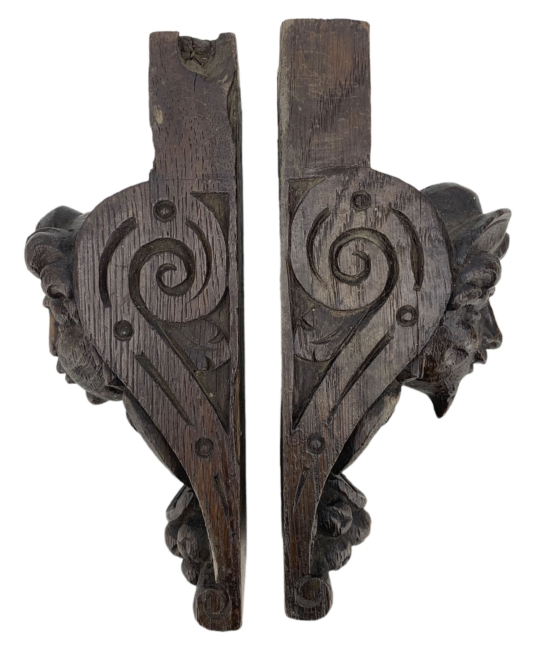 Pair of Victorian figural carved oak corbels, modelled as male and female masks, with scroll and fruit details, H22cm x W8.5cm 