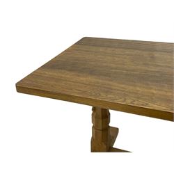 Mouseman - oak dining table, rectangular adzed top with rounded corners, octagonal pillar supports on sledge feet united by floor stretcher, carved with mouse signature, by the workshop of Robert Thompson, Kilburn