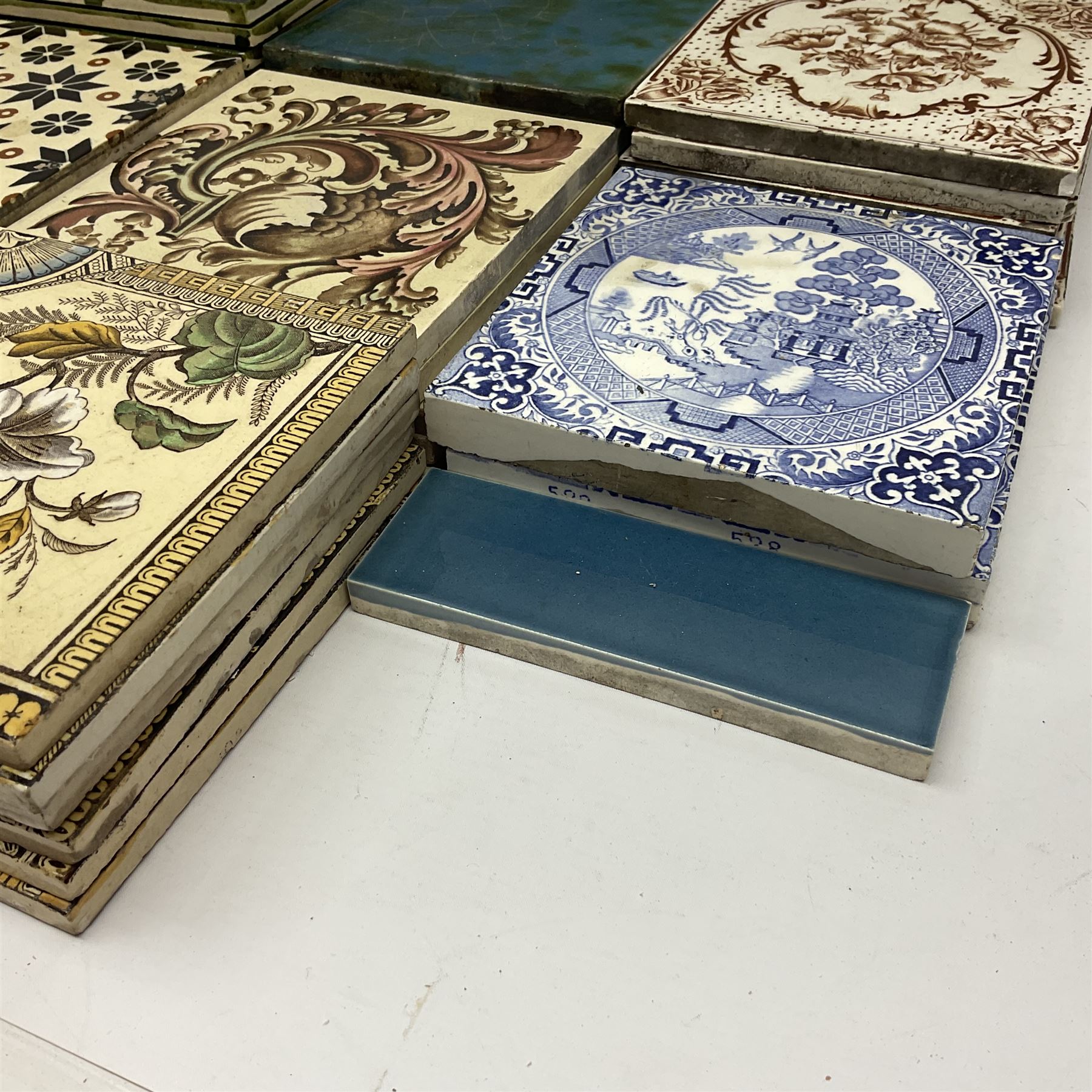 Collection of Victorian and later tiles to include floral and tube line examples