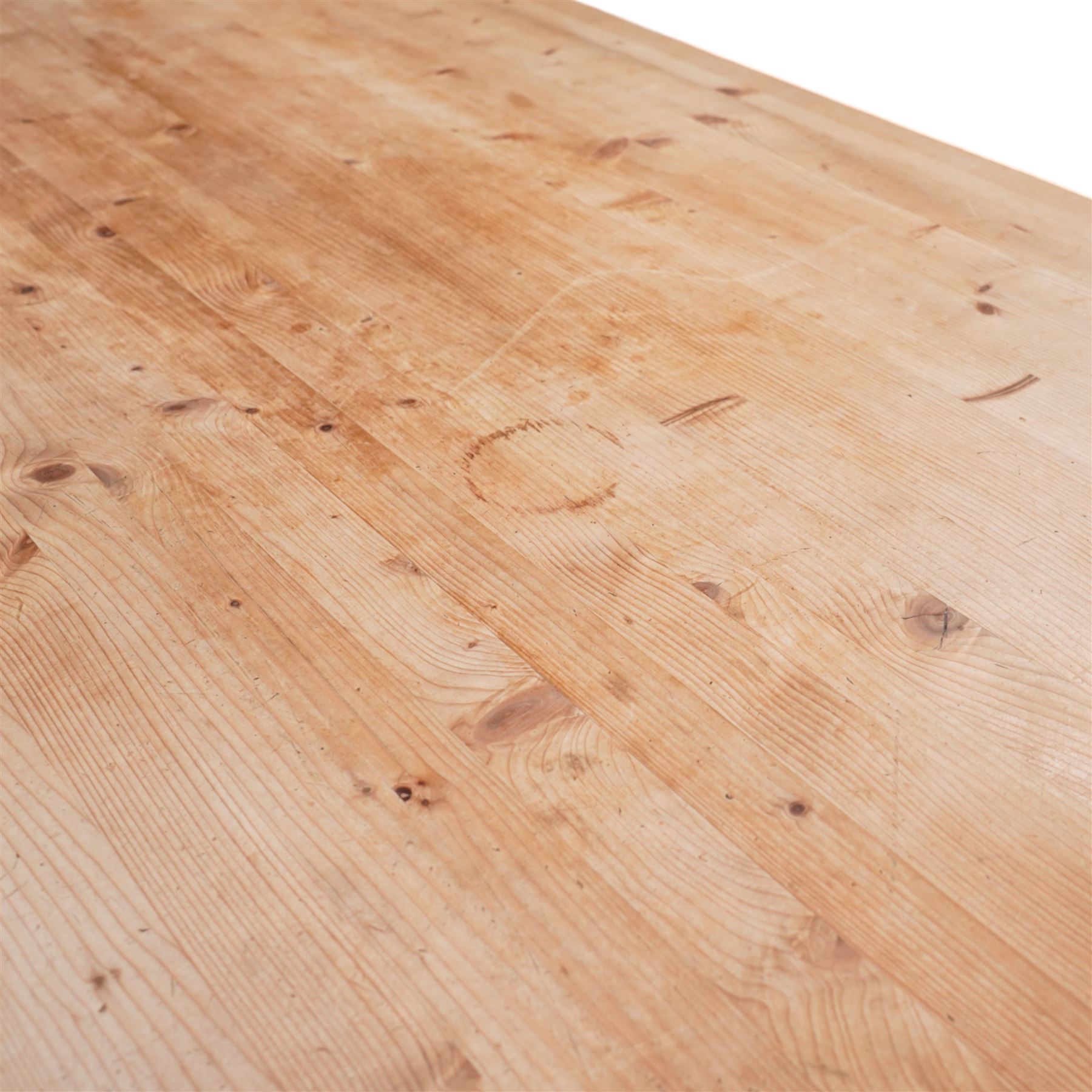 Waxed pine refectory table, boarded top with cleated ends, on turned supports united by H-stretchers 