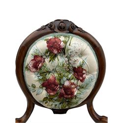 Victorian walnut framed nursing chair, the cameo open back with cartouche carved cresting rail, upholstered in buttoned rose pattern fabric, carved cabriole supports