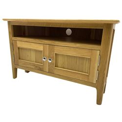 Contemporary light oak corner television stand, hexagonal top over recessed shelf, fitted with two panelled cupboard doors with chrome handles, on straight supports with rounded inner edges