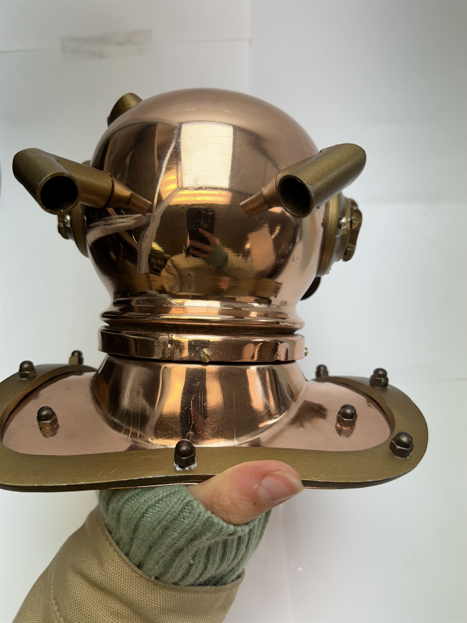 Copper novelty miniature diving helmet, together with underwater camera, helmet H20cm