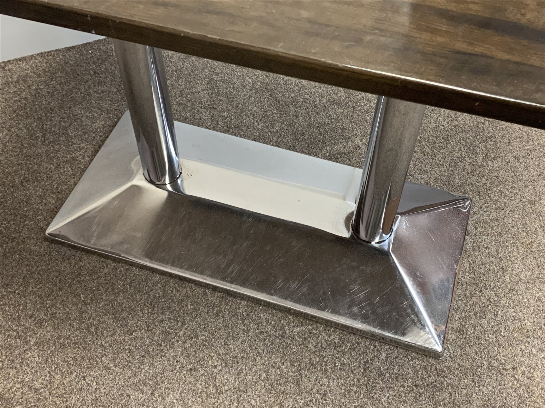 Two rectangular top café bistro tables on polished metal bases, 92cm x 68cm, H75cm