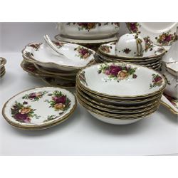 Royal Albert Old Country Roses pattern part tea and dinner service, to include two tureens, eight dinner plates, six side plates, twelve bowls, two mugs, seven teacups and saucers, milk jug,  twelve cake plates, six soup bowls and saucers, candlesticks, etc (95)