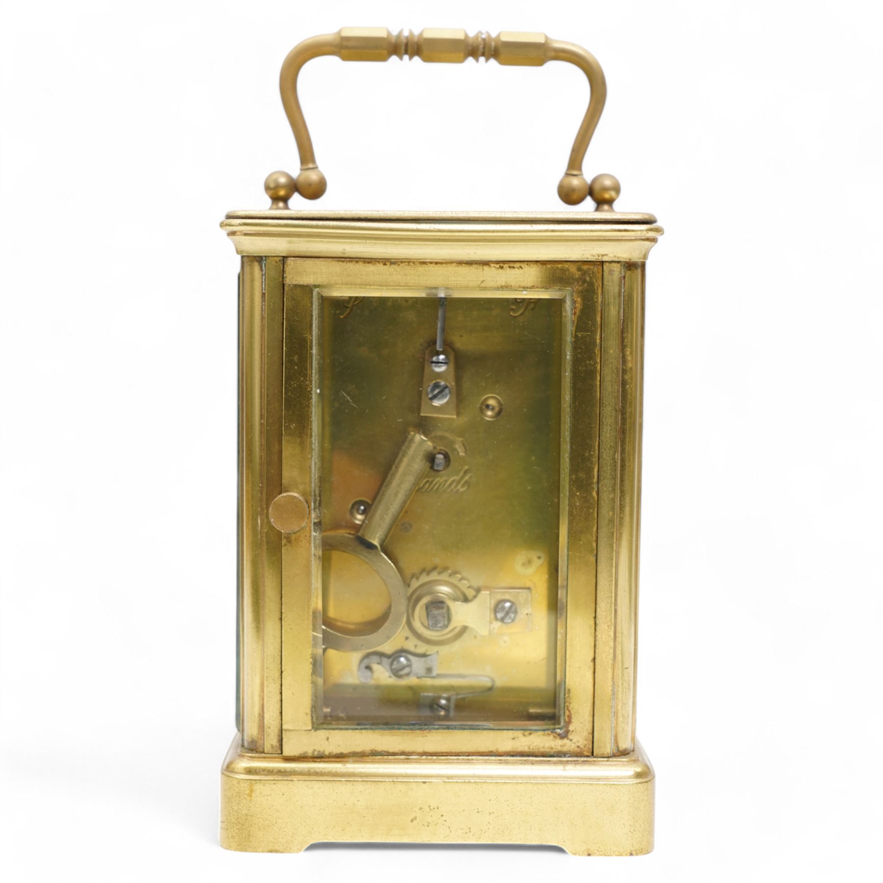 French - Early 20th century 8-day brass carriage clock in a corniche case, with rectangular glazed  panels and an oval viewing glass to the top, enamel dial with raised and gilded decoration in the form of swallows, leaves and flora, contrasting Arabic numerals and steel spade hands, with a cylinder platform escapement, wound and set from the rear. With key.