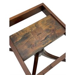 Georgian design inlaid chestnut wood centre table, the circular tilt-top inlaid with satinwood banding, gun barrel turned pedestal on four out-splayed supports, cast brass hairy paw castors, stamped 'P.H.R & Co. Holt, England' 