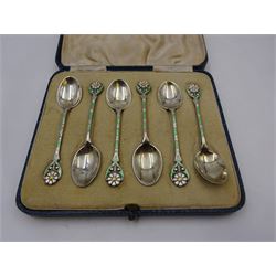 Set of six 1930s silver coffee spoons, each with enamelled daisy decoration to terminal with green and white enamelled stems, hallmarked Turner & Simpson Ltd, Birmingham 1936, contained within fitted case