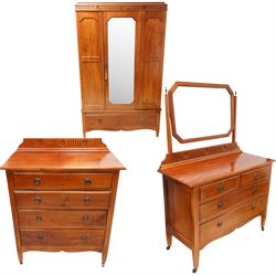 Early 20th century mahogany three piece bedroom suite - comprising a triple wardrobe (W119cm D47cm H194cm); chest with raised back, fitted with four long drawers (W93cm D49cm H115cm); and dressing table with swing mirror back (W108cm D49cm H152cm), each decorated with rosette and fluted designs, on square tapering feet