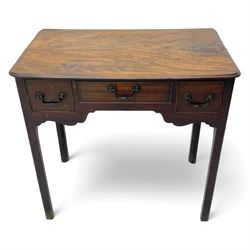 George III mahogany low-boy, moulded rectangular top with rounded front corners, fitted with three cock-beaded drawers, beaded circular brass handle plates and swan neck handles, shaped apron, on square supports with inner chamfer 