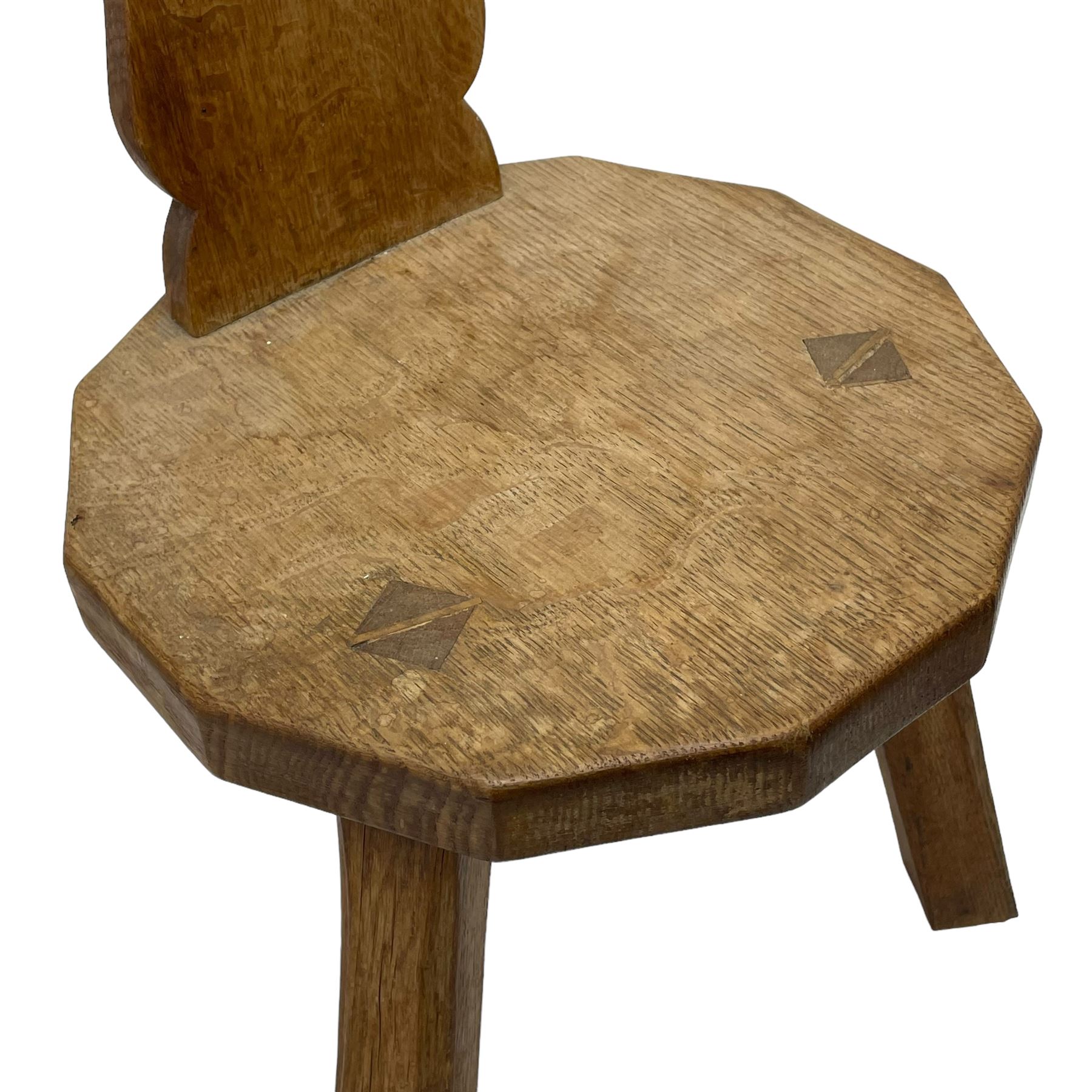 Gnomeman - two oak spinning or hall chairs, shaped splat backs, one carved with Yorkshire Rose, the other with mythical dragon, decagon seats on chamfered square tapering supports, each carved with gnome signature, by Thomas Whittaker, Littlebeck