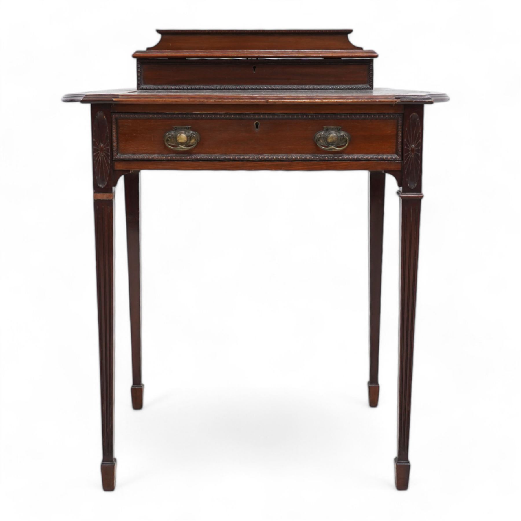 Edwardian mahogany writing desk, raised hinged compartment fitted with divisions, shaped and moulded top with leather inset, fitted with single drawer, on fluted square tapering supports with spade feet