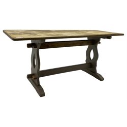 20th century oak refectory dining table, rectangular stripped top on painted base, shaped end supports on sledge feet united by two pegged stretchers