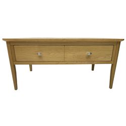 Contemporary light oak rectangular coffee table, fitted with single drawer disguised as two drawers to each side, on tapering supports