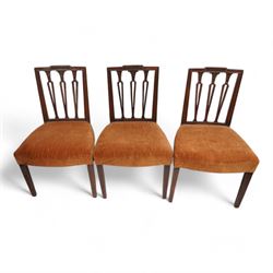 Set of three Edwardian mahogany dining chairs, fluted cresting rail over shaped and pierced vertical slats with foliate carved capitals, upholstered in mustard fabric, on square tapering supports (H89cm, W53cm); Edwardian satinwood inlaid mahogany open armchair, interlacing oval back over shaped arms, on square tapering supports with spade feet (W56cm, H91cm); 20th century pair of Hepplewhite Revival mahogany dining chairs (W52cm, H97cm) (6)