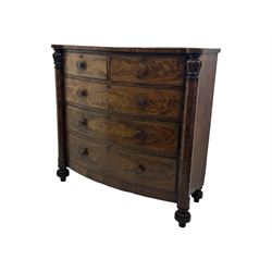 Early Victorian mahogany bow front chest, two short over three long graduating cockbeaded drawers, flanked by faceted columns with carved acanthus leaf capitals, standing on turned bun supports with fluted detailing