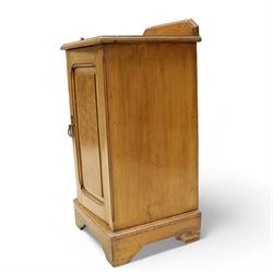 Late Victorian ash and walnut bedside pot cupboard, raised canted back over square moulded top, enclosed by single panelled door with figured walnut veneer, on bracket feet 