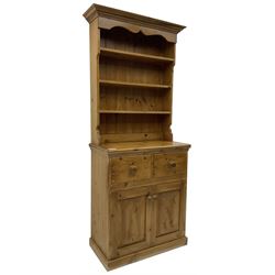 Solid pine dresser, fitted with plate rack above two drawers and two cupboards