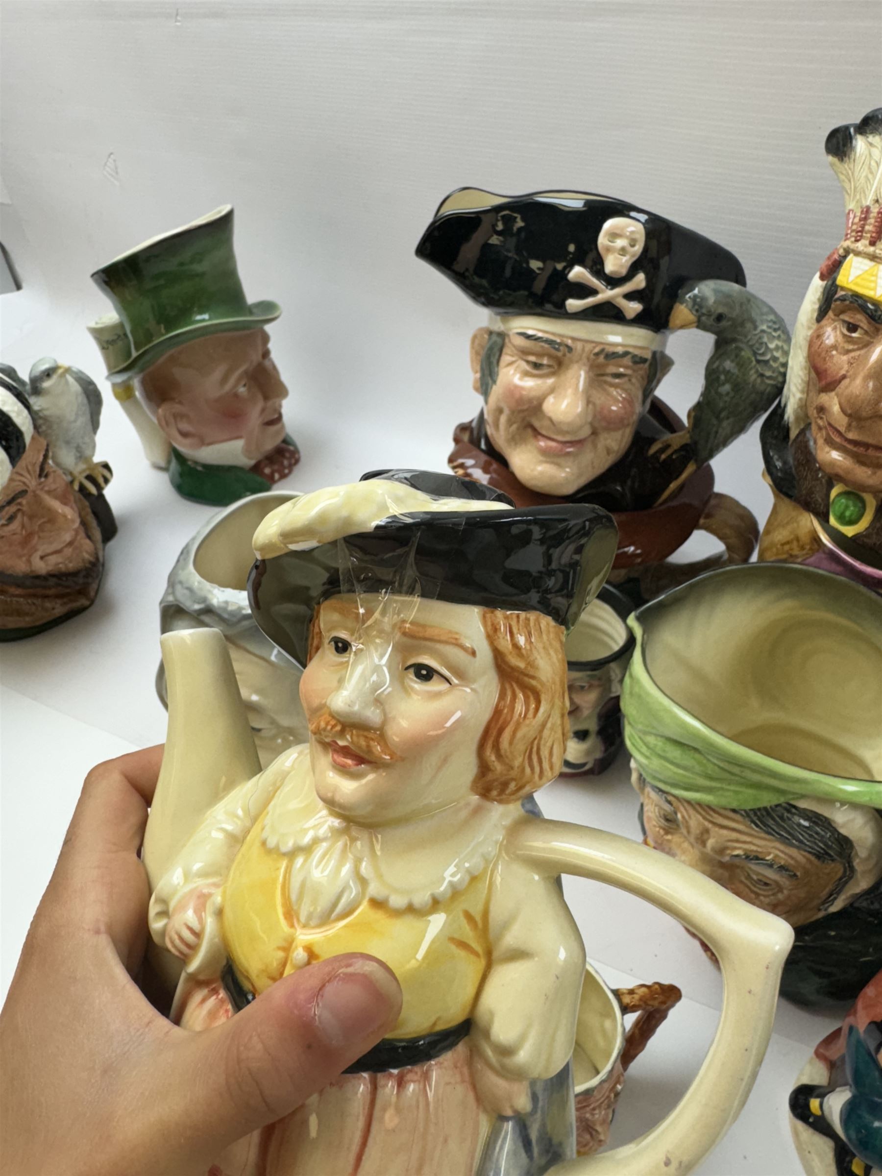 Collection of character jugs, including Royal Doulton Long John Silver, The Falconer, Granny etc