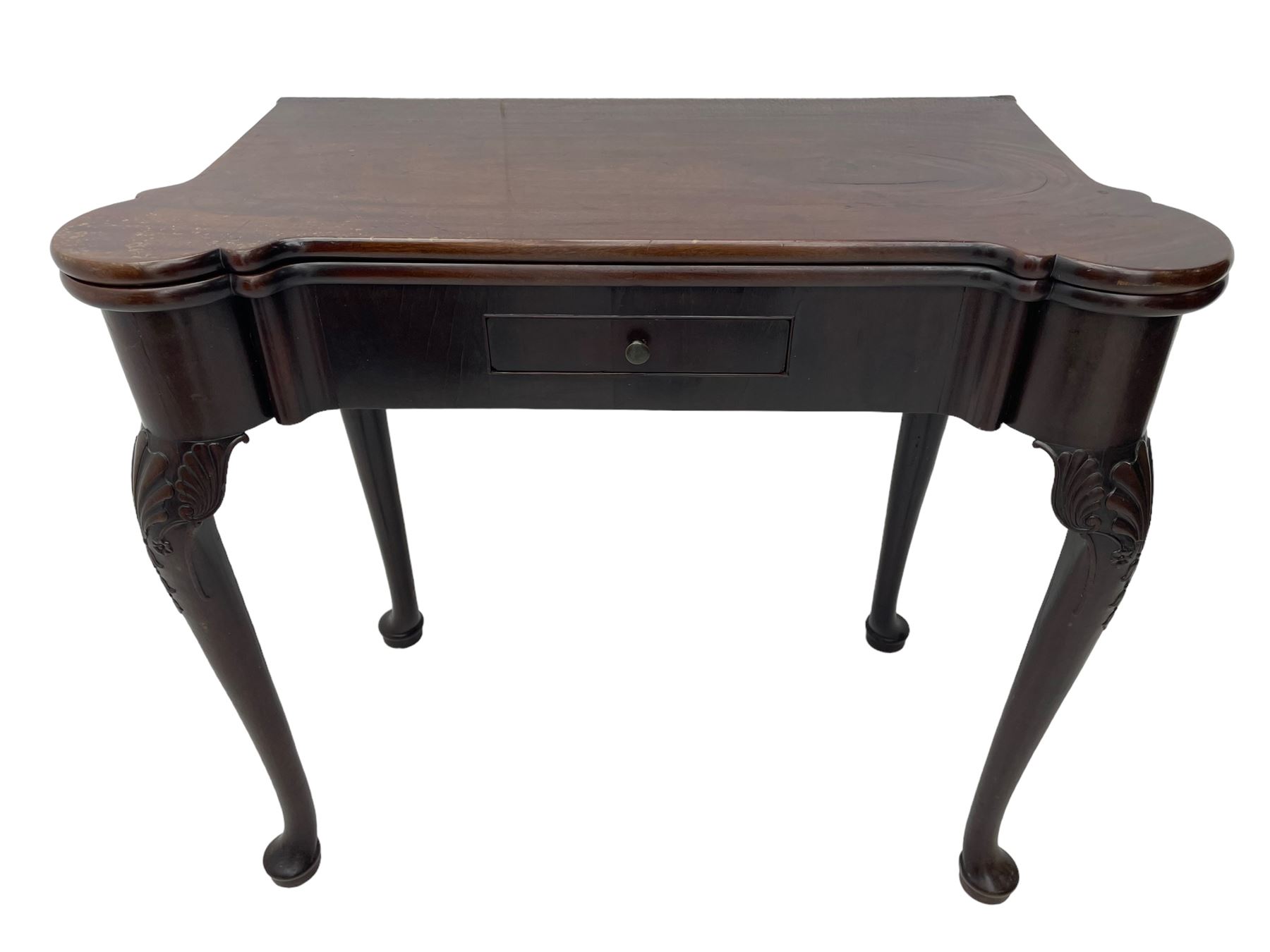 Late 18th century Irish mahogany tea table, rectangular form with projecting stepped rounded corners, fold-over action top over single frieze drawer within cock-beaded surround, on shell and bellflower carved cabriole supports, single gate-leg action base 