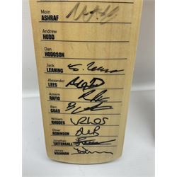Two signed Yorkshire County cricket bats, from 2013 and 2014 seasons, bearing signatures including Johnny Bairstow, Joe Root, Tim Bresnan, Andrew Gale, etc