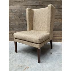 High wing back armchair, upholstered in oatmeal fabric