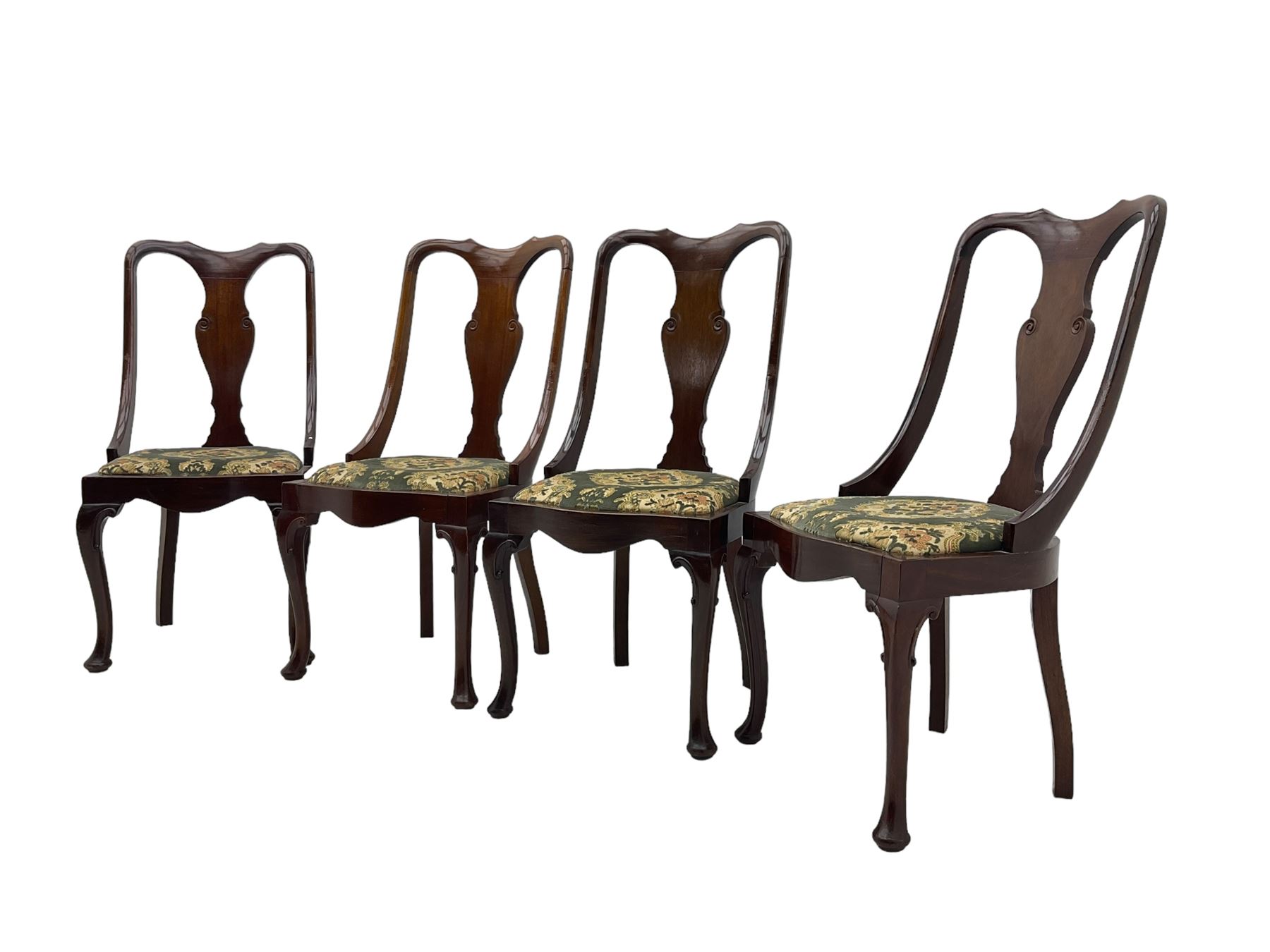 Set of eight late 19th century mahogany spoon back dining chairs, each with shaped top rail over Queen Anne design vase-shaped splat, upholstered seats in floral patterned fabric, raised on cabriole supports with scroll carved knees